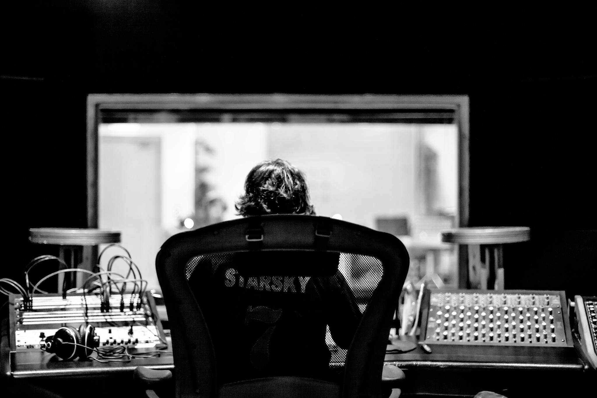 Jonathan Kossov at the mix position, full view of the studio